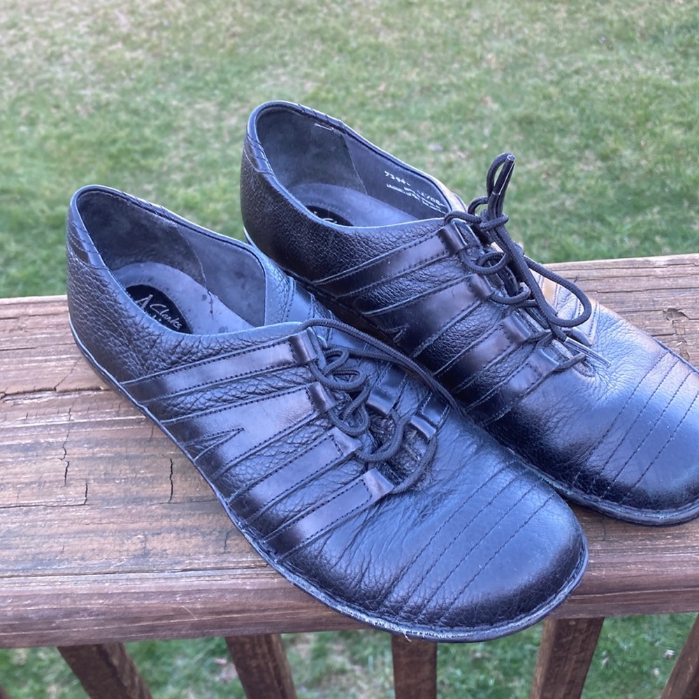 Clarks black leather, lace up shoes.